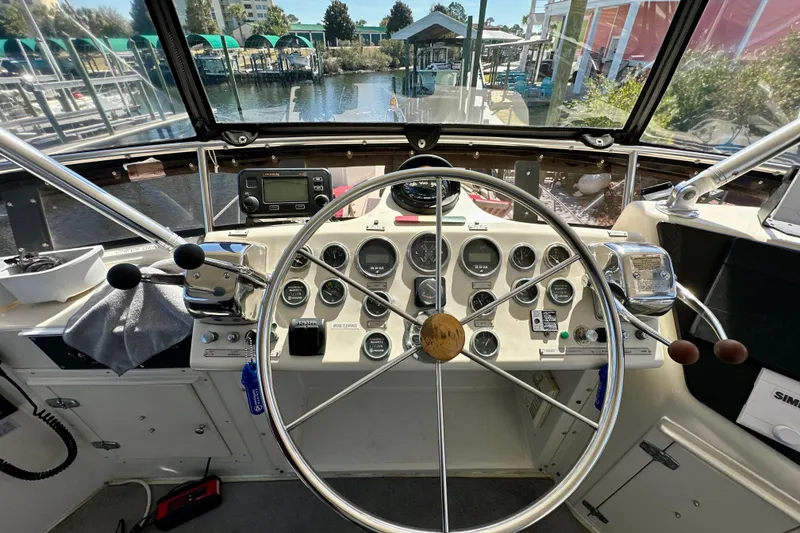 Slide: The Image of Helm of 1988 Californian 45 Motor Yacht with steering wheel and control panel. - 33