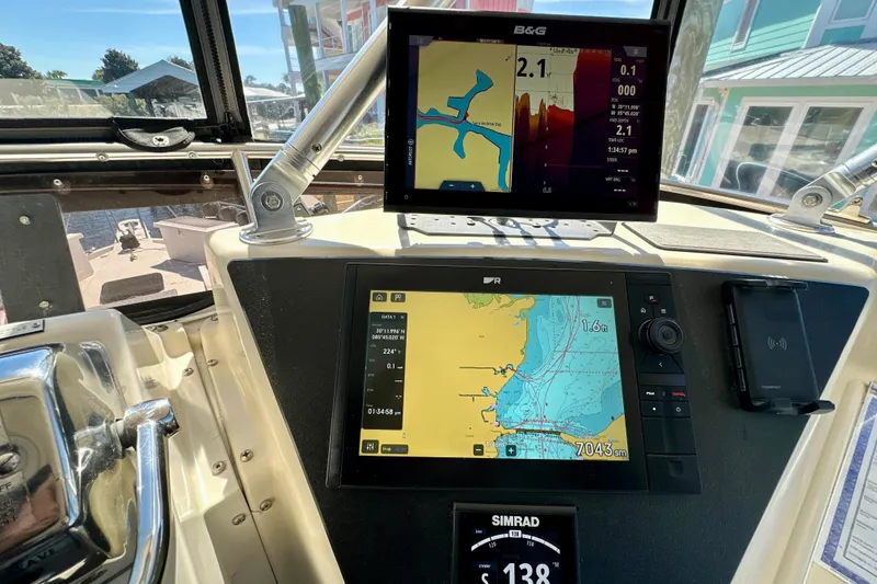 Slide: The Image of 1988 Californian 45 Motor Yacht helm with navigation screens and controls. - 35