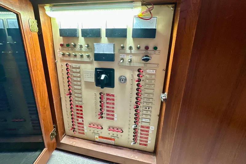 Slide: The Image of Electrical panel of 1988 Californian 45 Motor Yacht with switches and indicators. - 38