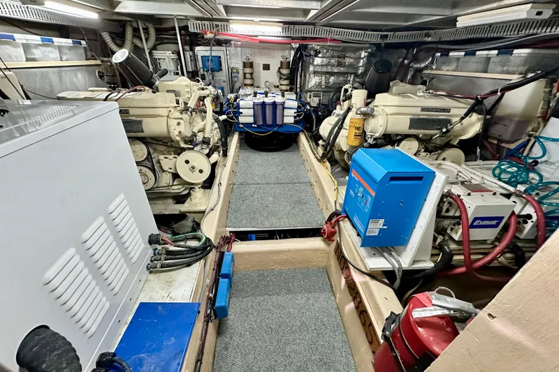 Slide: The Image of Engine room of a 1988 Californian 45 Motor Yacht with dual Caterpillar engines. - 40
