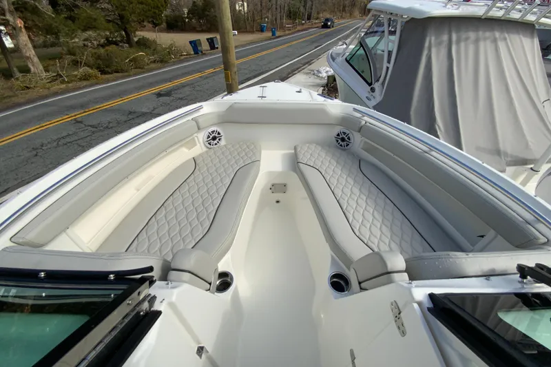 Slide: The Image of 2026 Pursuit DC 266 Dual Console boat with luxurious seating and modern design. - 12