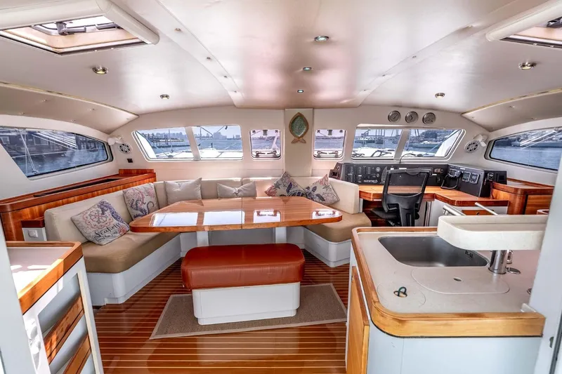 Slide: The Image of Luxurious interior of 2012 Outremer 49 catamaran with spacious seating and modern amenities. - 11