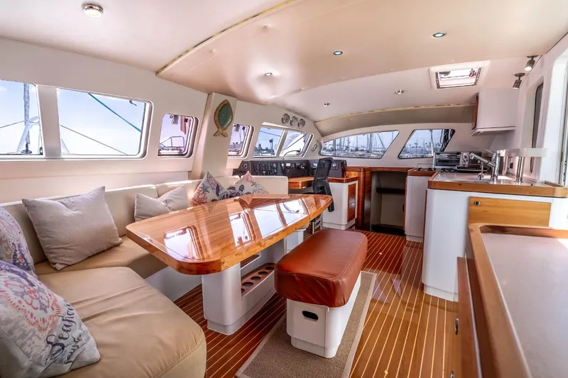 Slide: The Image of Luxurious interior of 2012 Outremer 49 catamaran with elegant seating and modern kitchen. - 12