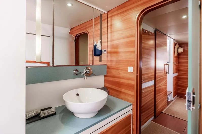 Slide: The Image of Luxurious bathroom interior of 2012 Outremer 49 yacht with modern sink and wood paneling. - 23