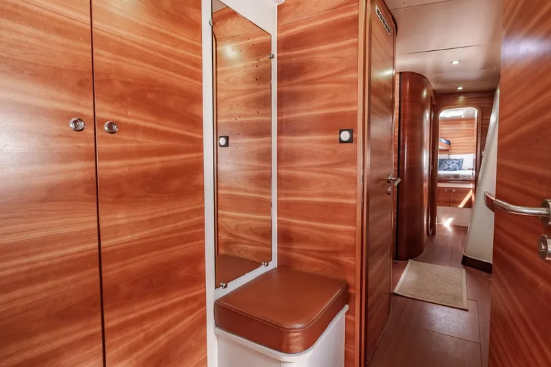 Slide: The Image of Luxurious wooden interior of a 2012 Outremer 49 yacht cabin hallway. - 28