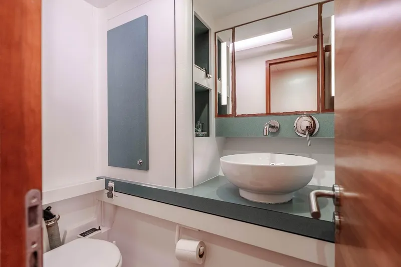 Slide: The Image of Modern bathroom in 2012 Outremer 49 yacht with vessel sink and mirrored cabinet. - 32
