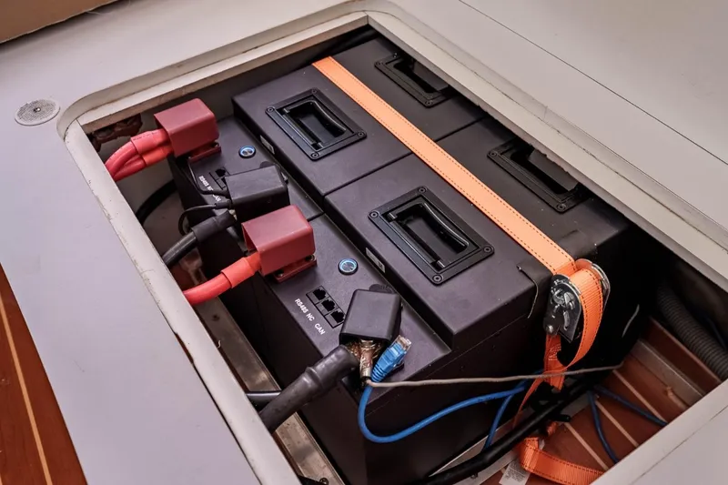 Slide: The Image of Battery compartment of a 2012 Outremer 49 yacht with secured connections. - 34