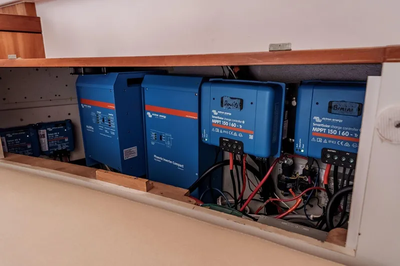 Slide: The Image of Electrical system setup in a 2012 Outremer 49 yacht, featuring Victron Energy components. - 35