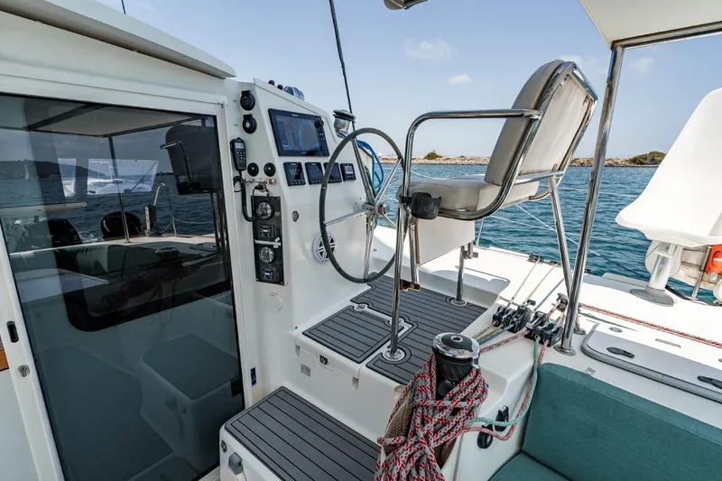Slide: The Image of Cockpit of 2012 Outremer 49 catamaran with steering wheel and navigation instruments. - 5
