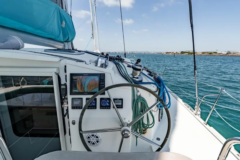 Slide: The Image of Cockpit of 2012 Outremer 49 sailboat with navigation equipment and steering wheel. - 7