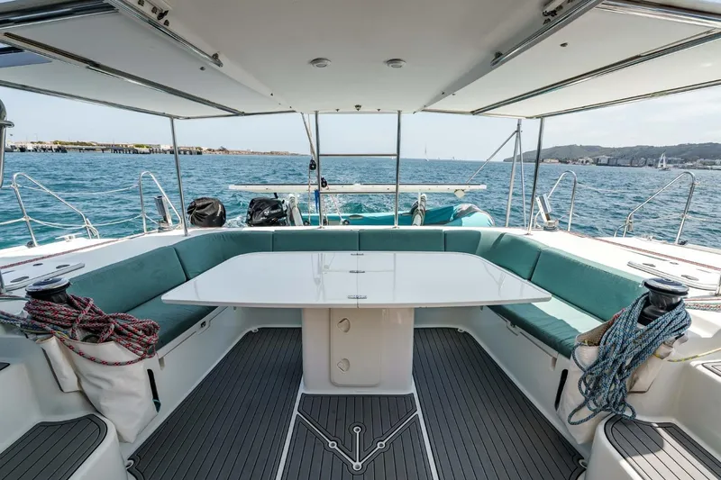 Slide: The Image of Spacious deck of 2012 Outremer 49 catamaran with seating and ocean view. - 9