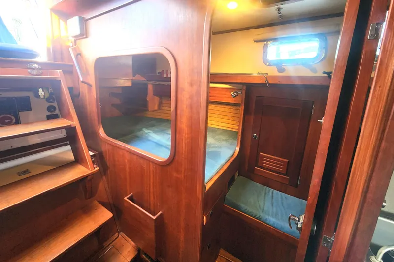 Slide: The Image of Cozy cabin interior of 2010 Valiant 42 CE/SE with wooden storage and comfortable bedding. - 19