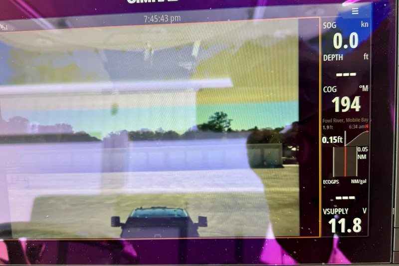 Slide: The Image of Boat navigation display on 2014 Invincible 36 Open Fisherman, showing course and speed data. - 15