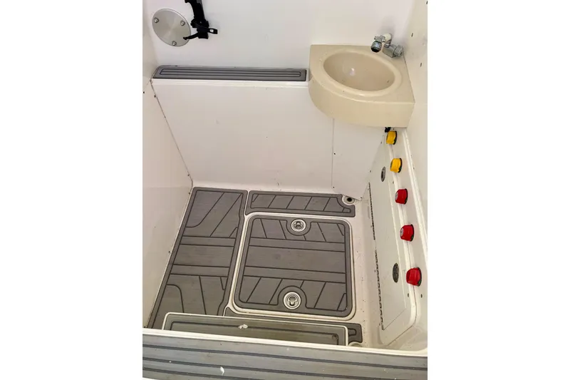 Slide: The Image of 2014 Invincible 36 Open Fisherman interior with sink and control panel. - 19