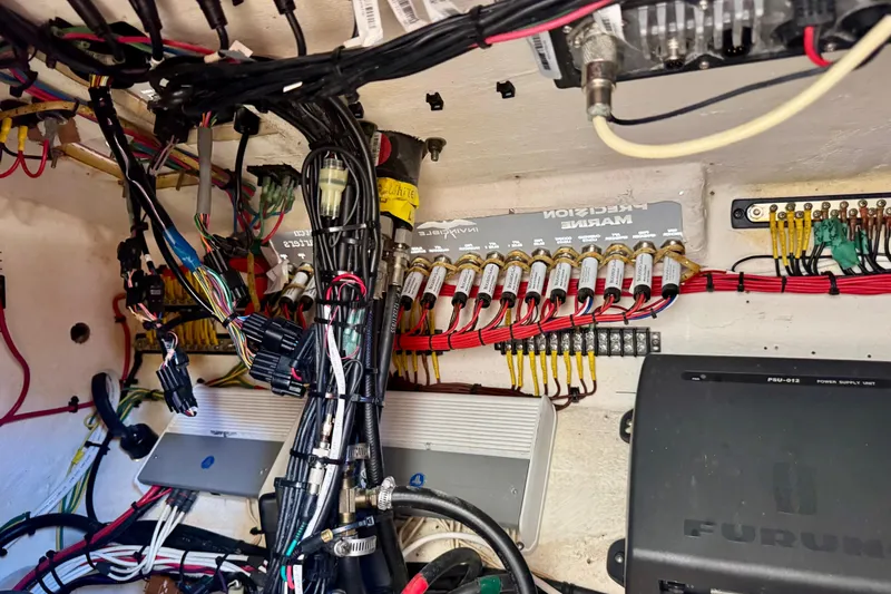 Slide: The Image of Electrical wiring and components inside a 2014 Invincible 36 Open Fisherman boat. - 20