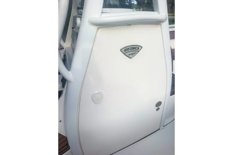 Slide: The Image of 2017 Tidewater 230 CC Adventure boat console with logo and sleek design. - 12