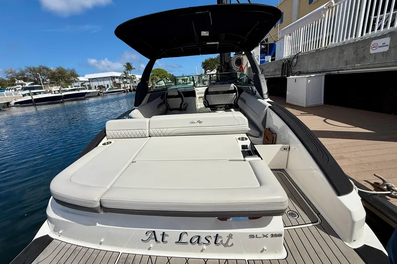 Slide: The Image of 2025 Sea Ray SLX 280 Outboard boat docked, featuring spacious seating and sleek design. - 19