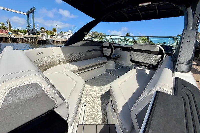 Slide: The Image of 2025 Sea Ray SLX 280 Outboard interior with luxurious seating and modern design. - 21
