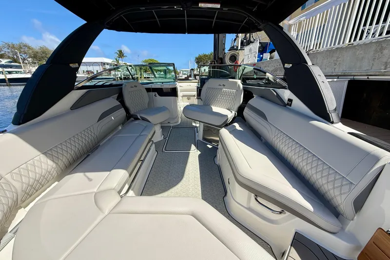 Slide: The Image of 2025 Sea Ray SLX 280 Outboard interior with luxurious seating and modern design. - 22