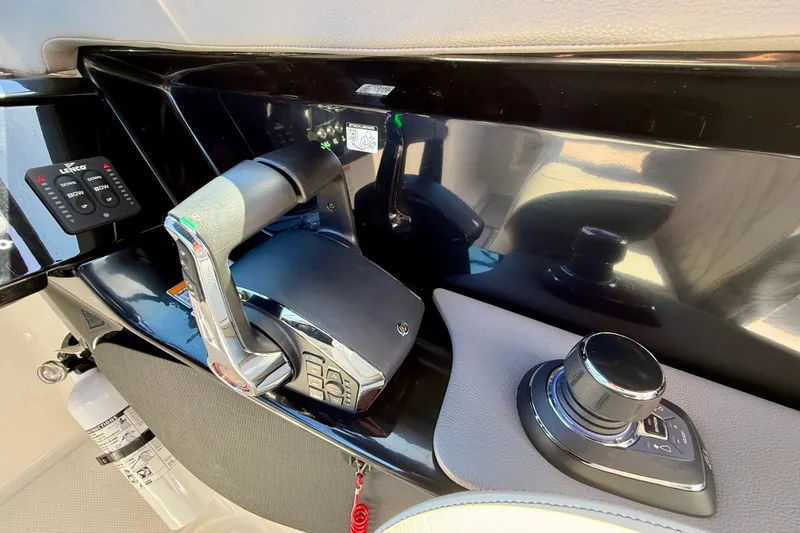 Slide: The Image of Control console of 2025 Sea Ray SLX 280 Outboard with controls. - 37