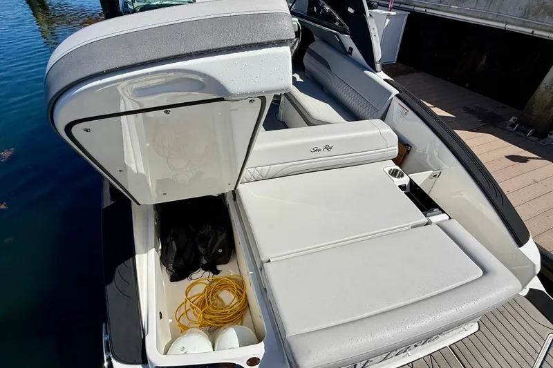 Slide: The Image of 2025 Sea Ray SLX 280 Outboard with storage and seating area. - 51
