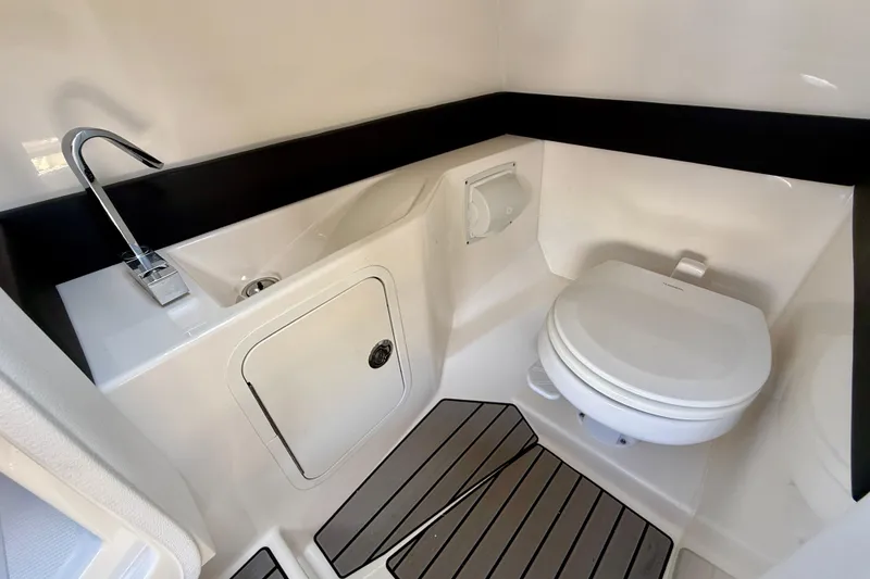Slide: The Image of 2025 Sea Ray SLX 280 Outboard boat bathroom with sink and toilet. - 55