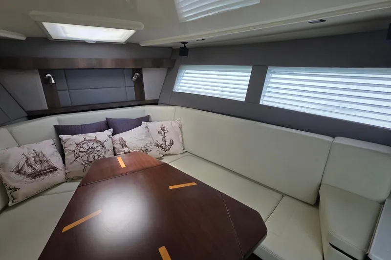 Slide: The Image of Luxurious interior of 2017 Monterey 360 Sport Coupe with nautical-themed cushions. - 22