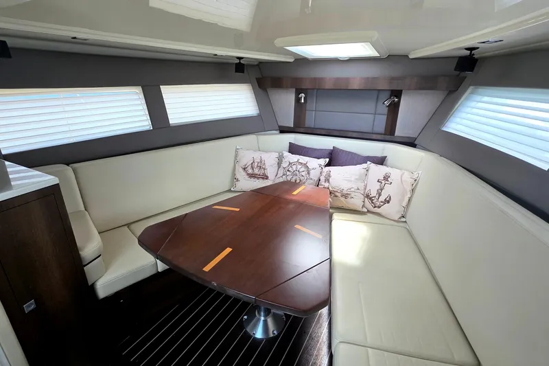 Slide: The Image of Luxurious interior of 2017 Monterey 360 Sport Coupe with elegant seating and nautical-themed decor. - 23