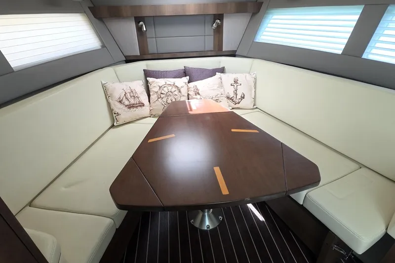 Slide: The Image of Luxurious interior of 2017 Monterey 360 Sport Coupe with elegant seating and nautical-themed cushions. - 26