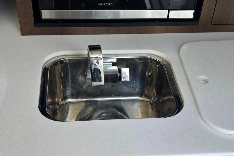 Slide: The Image of Stainless steel sink in 2017 Monterey 360 Sport Coupe yacht kitchen area. - 28