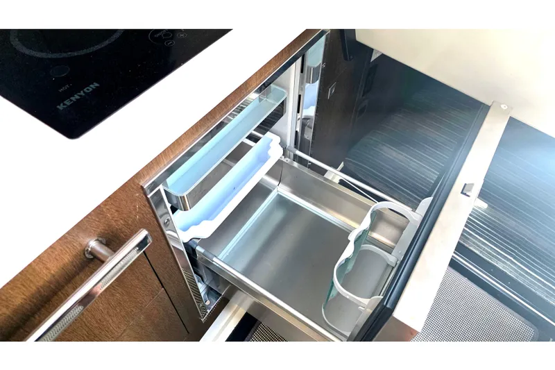 Slide: The Image of Modern kitchen drawer in 2017 Monterey 360 Sport Coupe yacht, featuring sleek design and storage. - 30