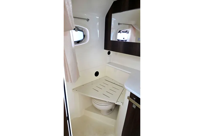 Slide: The Image of Bathroom interior of 2017 Monterey 360 Sport Coupe with compact design and porthole window. - 35