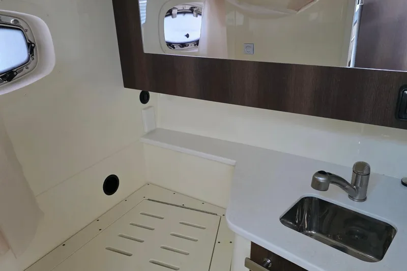 Slide: The Image of Interior of 2017 Monterey 360 Sport Coupe bathroom with sink and mirror. - 36