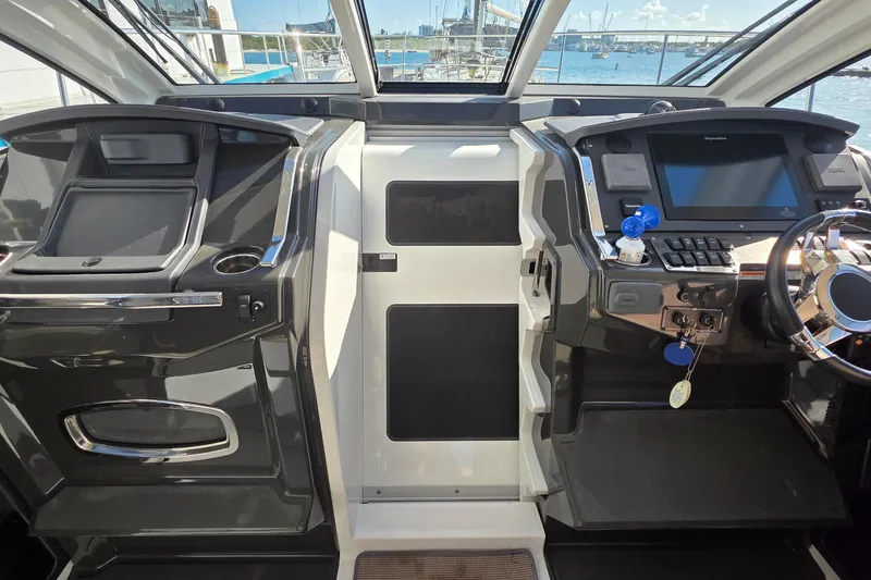 Slide: The Image of Interior cockpit of a 2017 Monterey 360 Sport Coupe with modern controls and steering. - 42