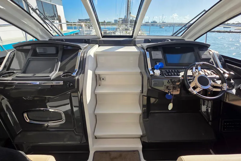 Slide: The Image of Cockpit of 2017 Monterey 360 Sport Coupe with modern controls and waterfront view. - 43