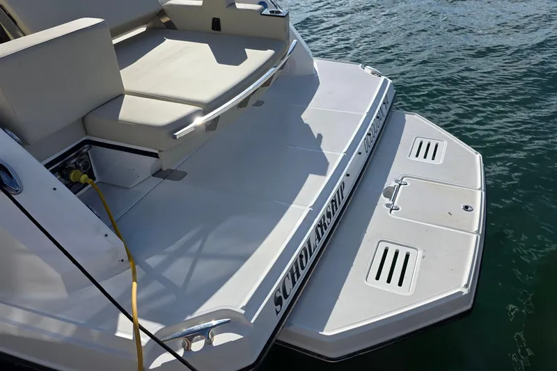 Slide: The Image of Rear view of 2017 Monterey 360 Sport Coupe boat with swim platform and seating. - 44