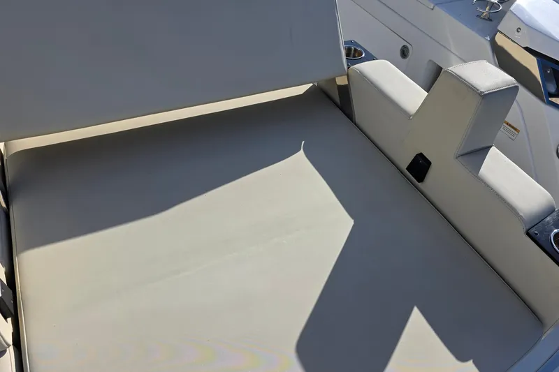 Slide: The Image of 2017 Monterey 360 Sport Coupe boat interior seating with cup holders and sleek design. - 45