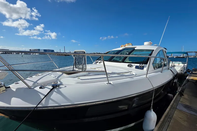 Slide: The Image of 2017 Monterey 360 Sport Coupe docked under clear blue sky. - 48