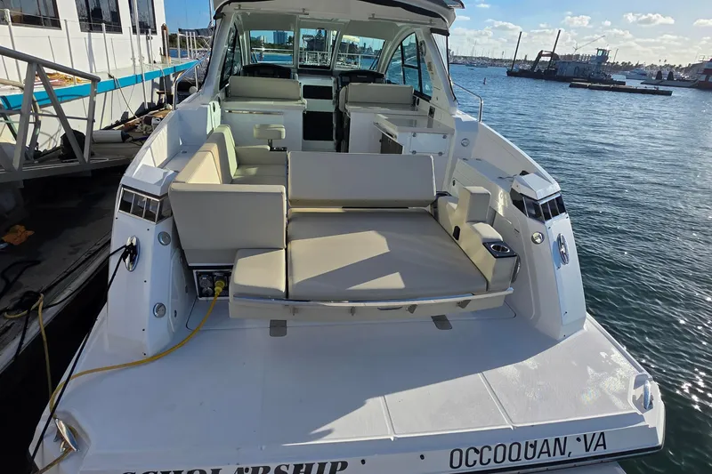 Slide: The Image of 2017 Monterey 360 Sport Coupe docked, featuring spacious seating and modern design. - 49