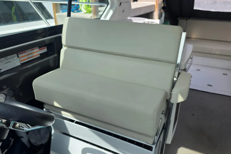 Slide: The Image of 2017 Monterey 360 Sport Coupe interior with beige seating and cup holder. - 6