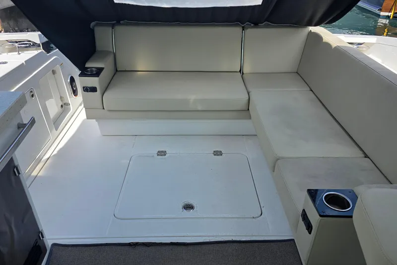 Slide: The Image of 2017 Monterey 360 Sport Coupe boat interior with sleek countertop and storage compartments. - 9