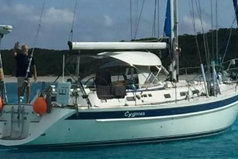 Slide: The Image of Sailing yacht Hallberg-Rassy 46, 2000 model, anchored in clear blue waters. - 25