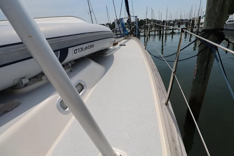 Slide: The Image of Deck view of 2000 Hallberg-Rassy 46 yacht with inflatable boat, docked at marina. - 30