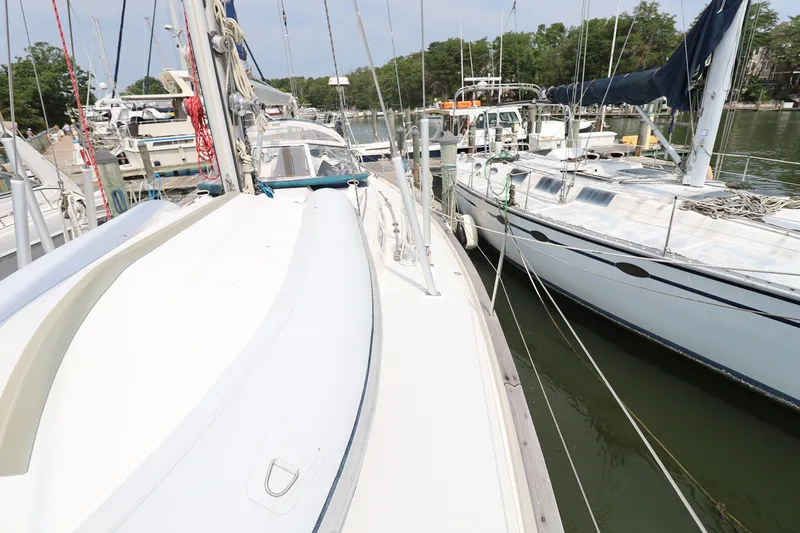 Slide: The Image of Sailboats docked at a marina, featuring a 2000 Hallberg-Rassy 46. - 34