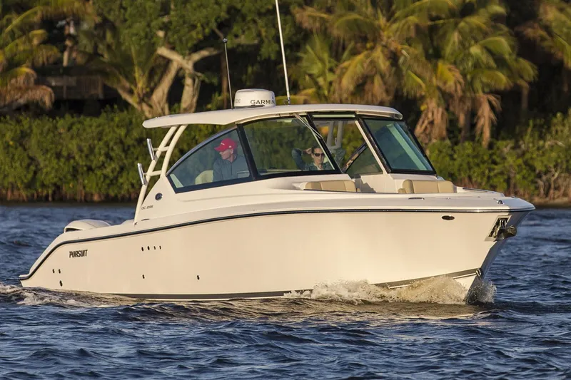 The Image of Manufacturer Provided Image: 2017 Pursuit DC 295 Dual Console boat cruising on water. - 0