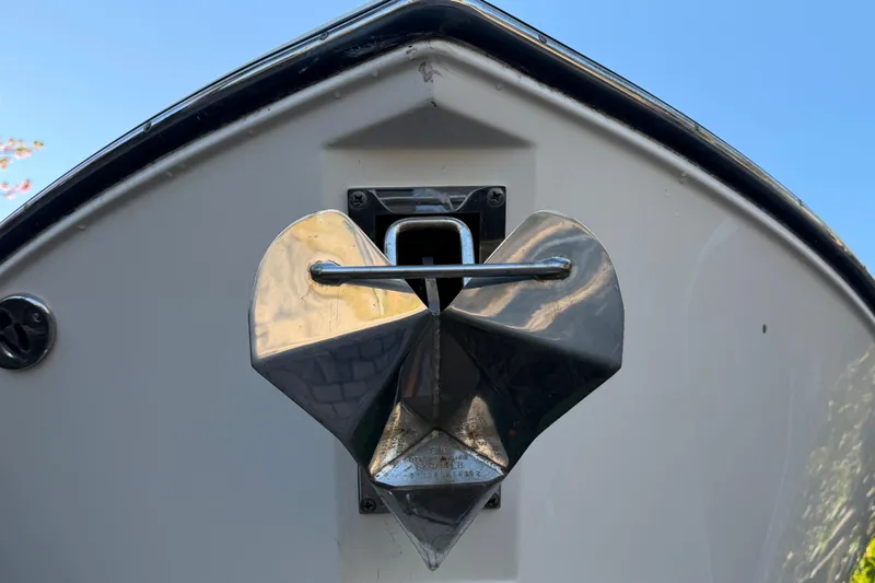 Slide: The Image of Bow of 2017 Pursuit DC 295 Dual Console with heart-shaped anchor detail. - 16