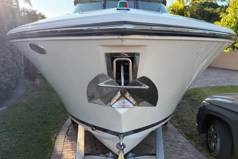 Slide: The Image of 2017 Pursuit DC 295 Dual Console boat on trailer, front view. - 18
