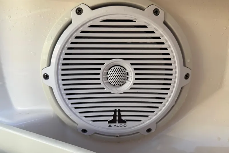 Slide: The Image of JL Audio speaker on 2017 Pursuit DC 295 Dual Console boat. - 33