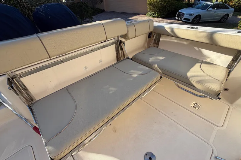 Slide: The Image of 2017 Pursuit DC 295 Dual Console boat with beige seating and foldable benches. - 36