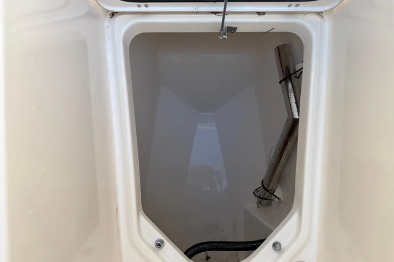 Slide: The Image of Storage compartment of 2017 Pursuit DC 295 Dual Console boat, showing interior details. - 44